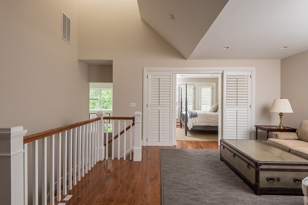 10 Backriver Road, Unit 10 Hingham, MA 02043 - Photo 21 of 30 a living room with furniture and a lamp