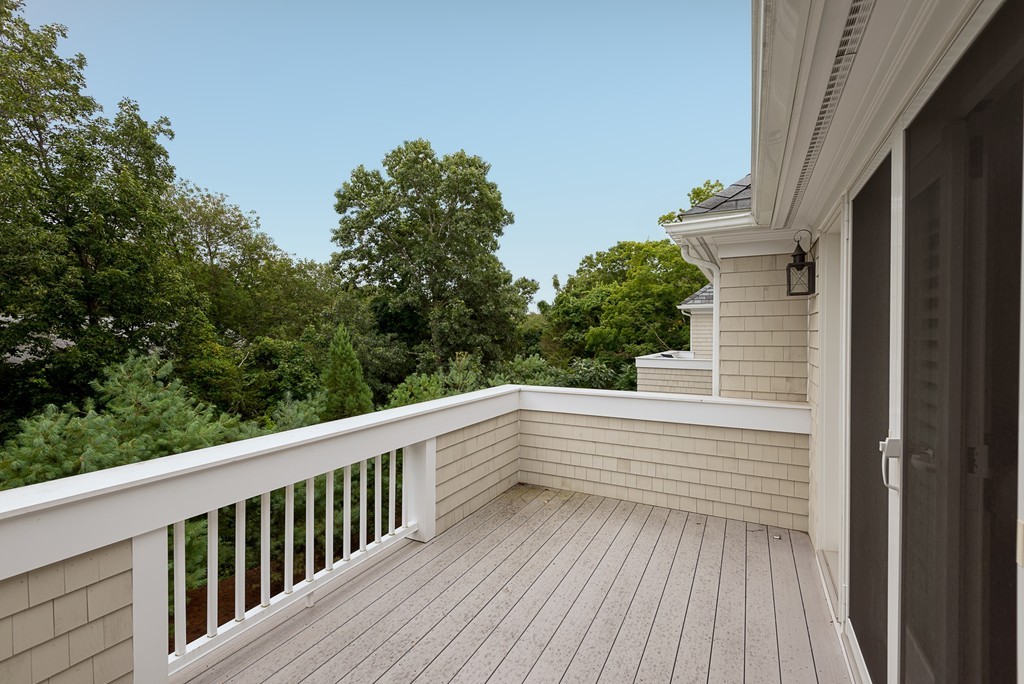 10 Backriver Road, Unit 10 Hingham, MA 02043 - Photo 23 of 30 a view of deck with wooden floor and fence