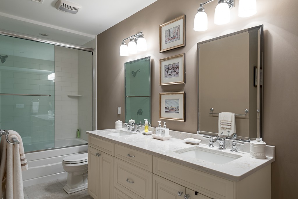 10 Backriver Road, Unit 10 Hingham, MA 02043 - Photo 28 of 30 a bathroom with a toilet sink and mirror