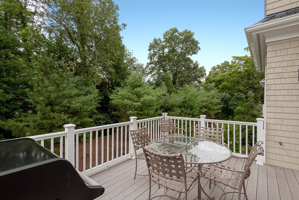 10 Backriver Road, Unit 10 Hingham, MA 02043 - Photo 29 of 30 a view of a chair and table on the deck