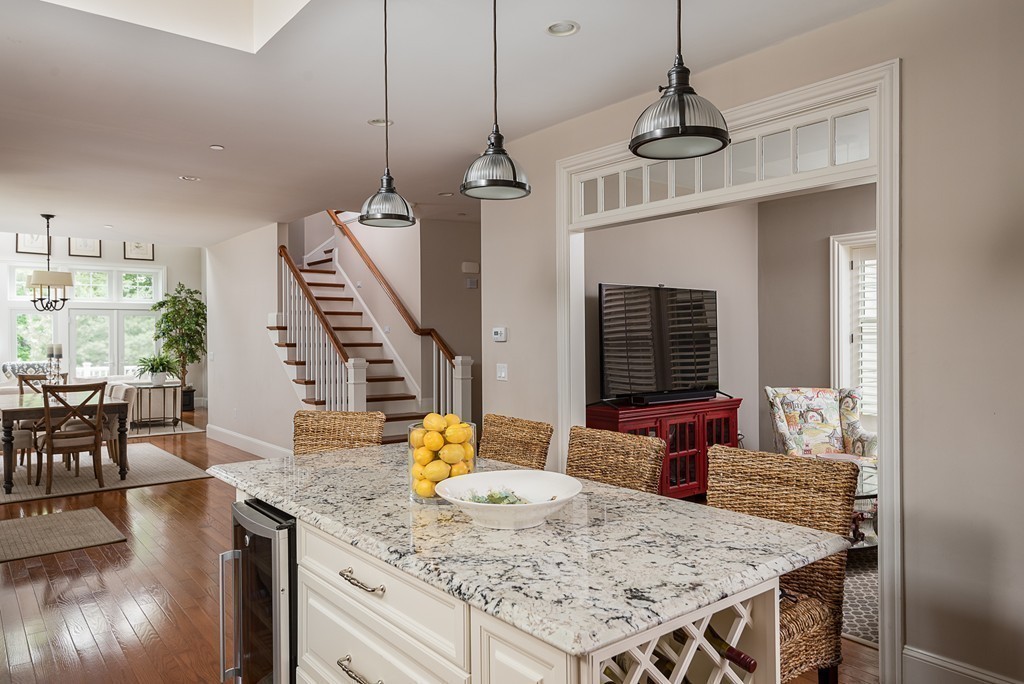 10 Backriver Road, Unit 10 Hingham, MA 02043 - Photo 3 of 30 a kitchen view with dining table and wooden floor