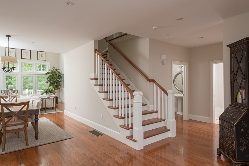10 Backriver Road, Unit 10 Hingham, MA 02043 - Photo 10 of 30 a view of entryway dining room and hall with wooden floor