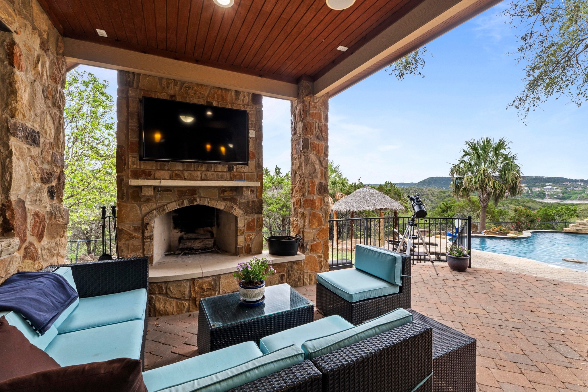 8211 Moon Rise Trail Jonestown, TX 78645 - Photo 21 of 34 Enjoy your morning coffee by the cozy outdoor fireplace.