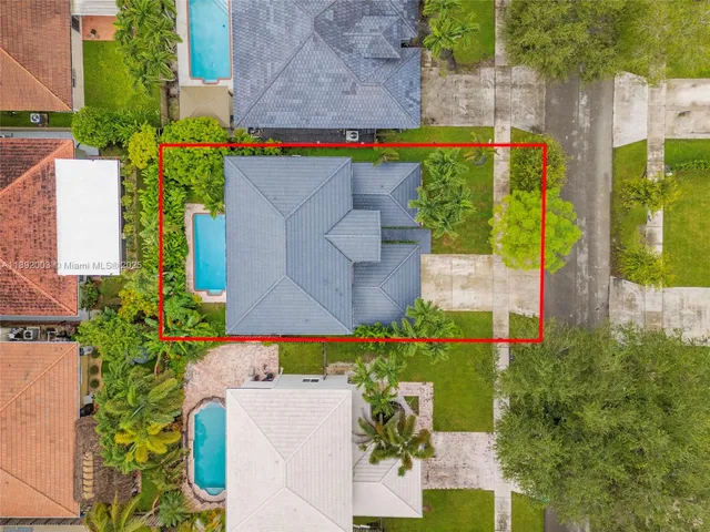 an aerial view of a house with a garden