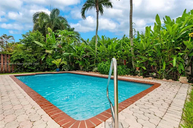a view of a swimming pool with a patio