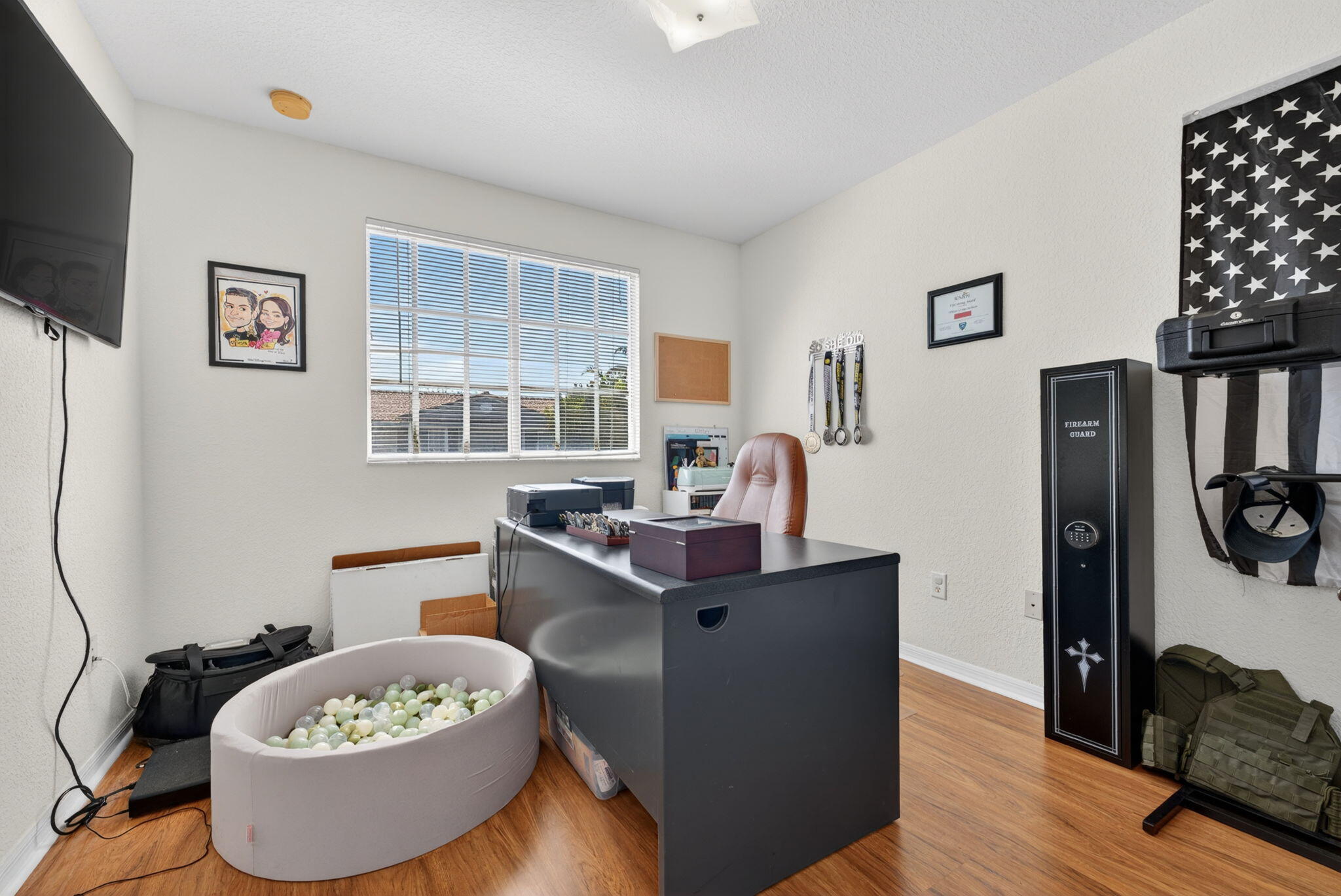 5951 Manchester Way Tamarac, FL 33321 - Photo 34 of 41 a room with a table chairs and a wooden floor