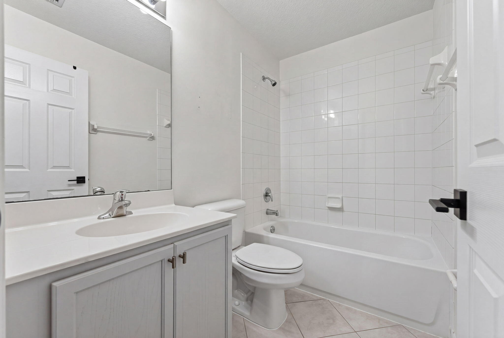 5951 Manchester Way Tamarac, FL 33321 - Photo 9 of 41 a bathroom with a sink a toilet and shower