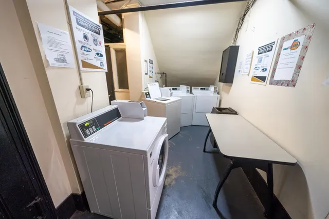 a living room with furniture and a mirror