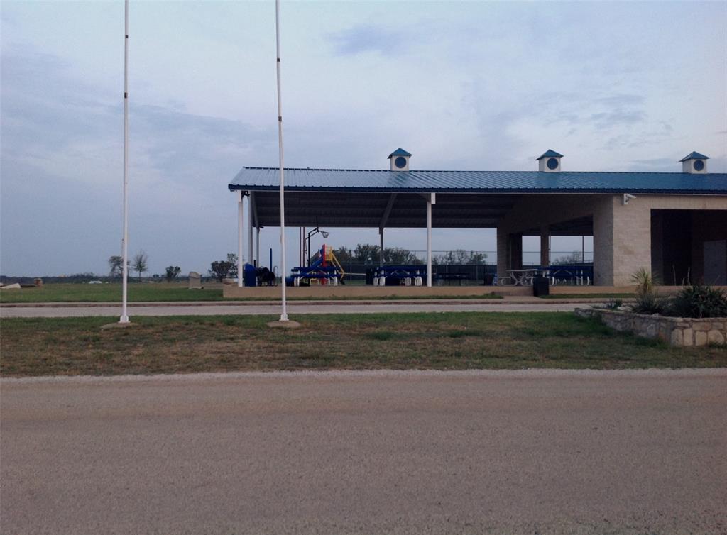 7092 Hells Gate Loop Strawn, TX 76475 - Photo 8 of 8 a view of a house with a yard