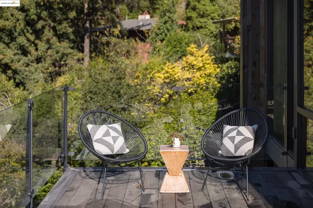 a living room with furniture wooden floor and a flat screen tv