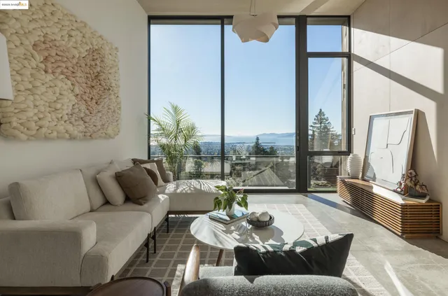 a large white bed in a small room