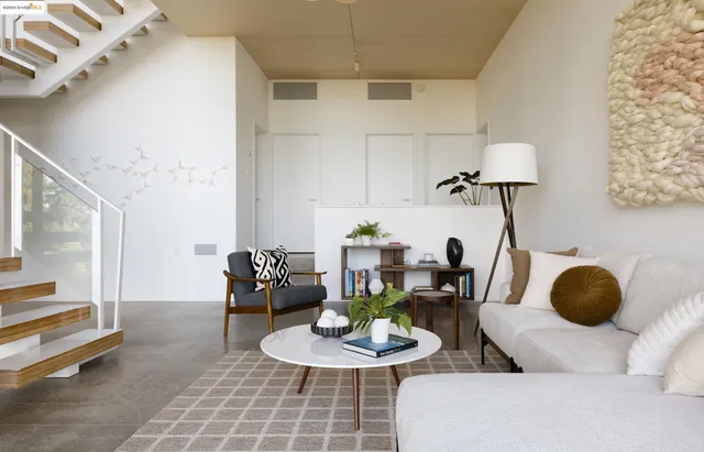 a view of living room with furniture and floor to ceiling window