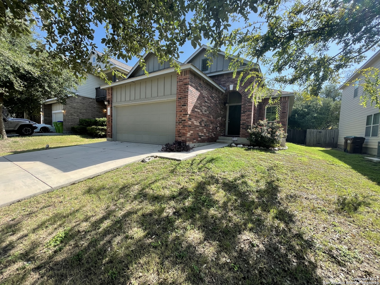 a view of a house with a yard and garage