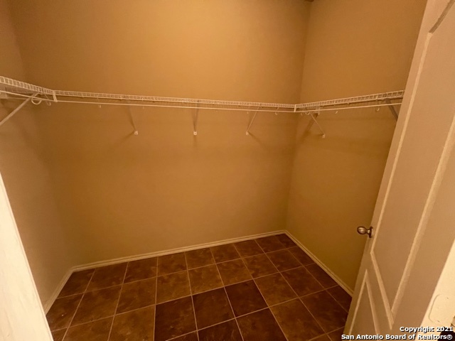 434 Tequila Ranch San Antonio, TX 78245 - Photo 18 of 21 a view of a room with racks on the wall