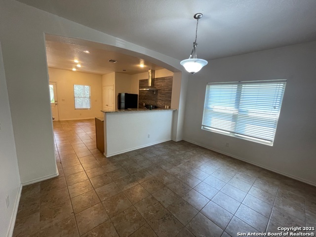 434 Tequila Ranch San Antonio, TX 78245 - Photo 9 of 21 a view of a kitchen with a sink and a window