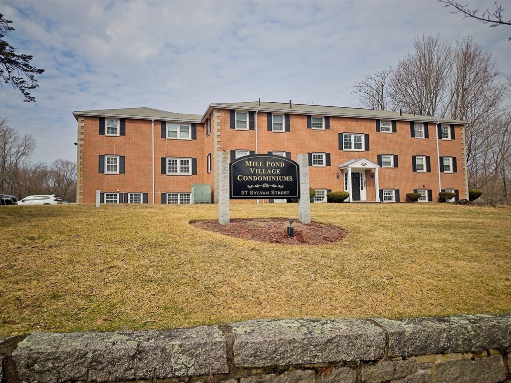 57 Sylvan Street, Unit 5D Danvers, MA 01923 - Photo 14 of 15 a front view of building with yard