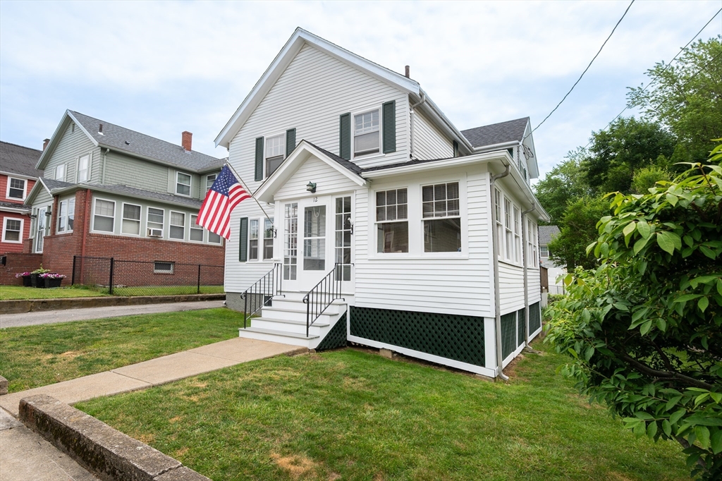 12 Riverside Avenue Gloucester, MA 01930 - Photo 2 of 40 a front view of a house with a yard