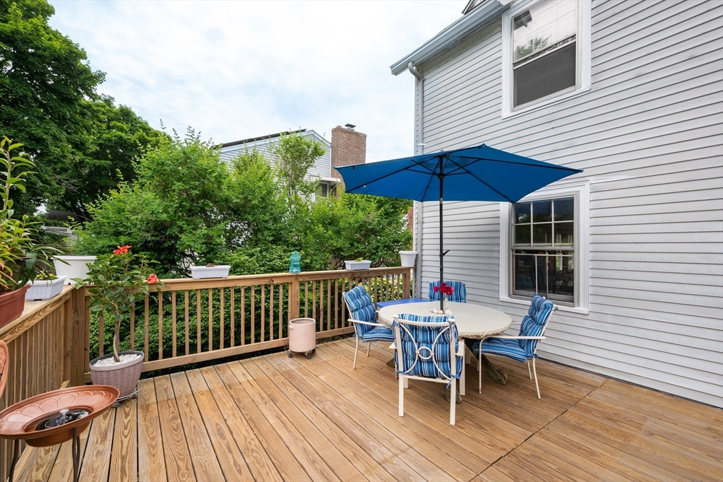 12 Riverside Avenue Gloucester, MA 01930 - Photo 30 of 40 an outdoor space with furniture and umbrella