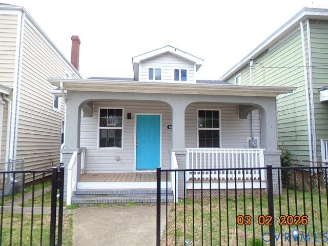 1807 T Street Richmond, VA 23223 - Photo 1 of 11 Bungalow-style home with a fenced front yard, a po