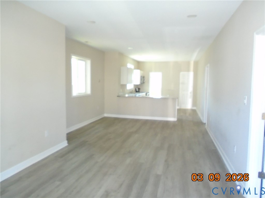 1807 T Street Richmond, VA 23223 - Photo 2 of 11 Unfurnished living room with dark wood-type floori