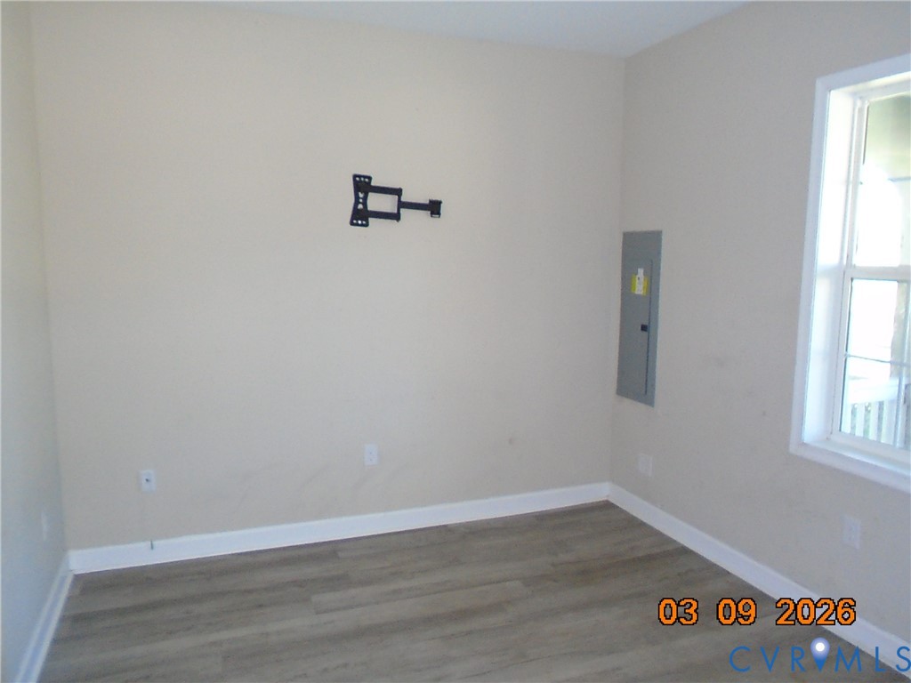 1807 T Street Richmond, VA 23223 - Photo 3 of 11 Spare room featuring dark wood-style flooring and