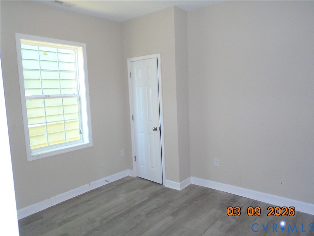 1807 T Street Richmond, VA 23223 - Photo 4 of 11 Empty room with wood finished floors and baseboard