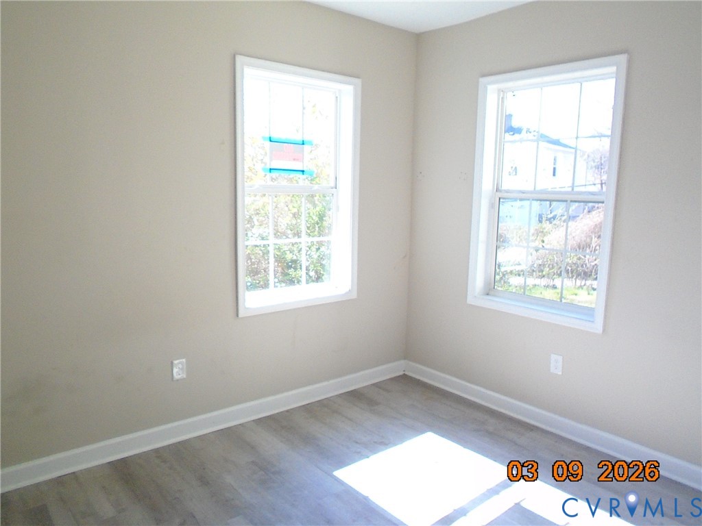 1807 T Street Richmond, VA 23223 - Photo 6 of 11 Unfurnished room featuring baseboards and light wo