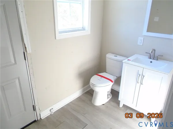 a white toilet sitting next to a bathroom sink
