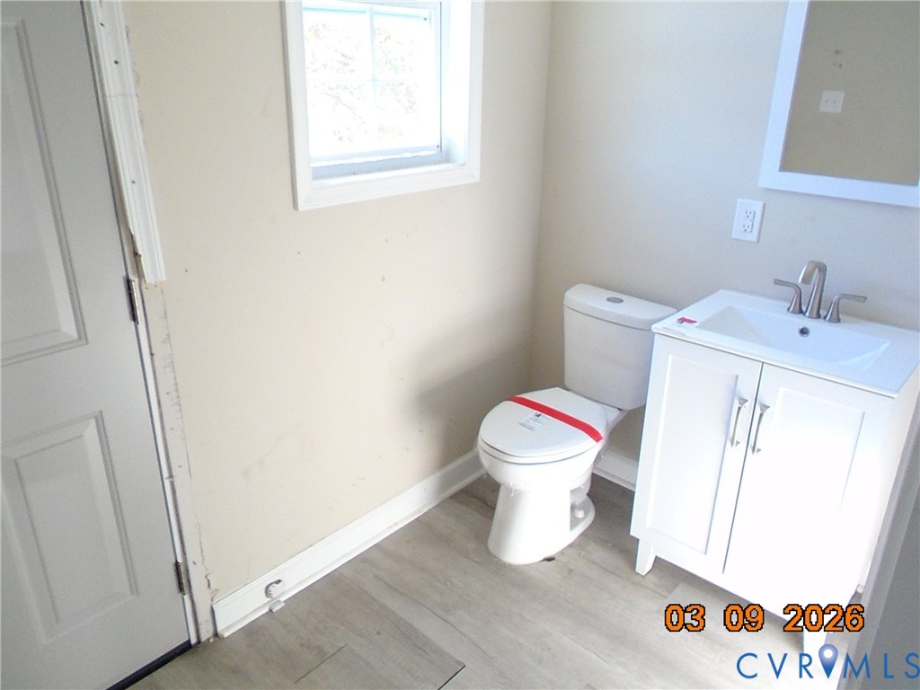 1807 T Street Richmond, VA 23223 - Photo 8 of 11 Half bathroom featuring vanity and light wood-type