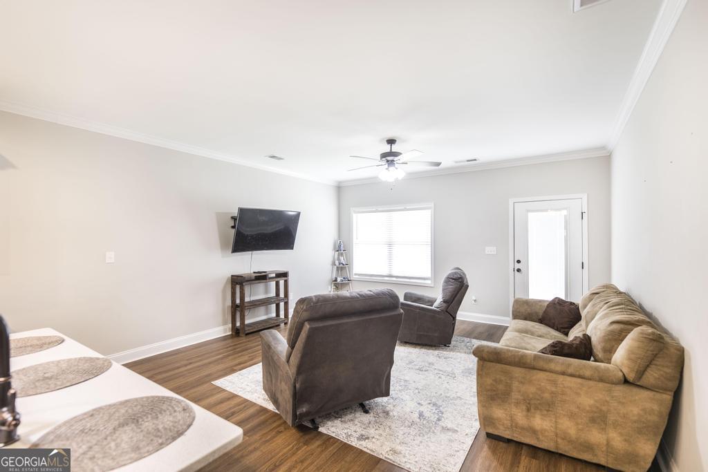 309 Charles Gray Boulevard Perry, GA 31069 - Photo 14 of 30 a living room with furniture and a flat screen tv