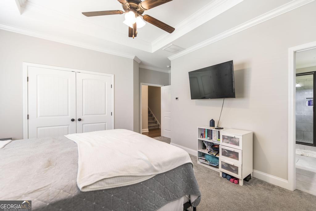 309 Charles Gray Boulevard Perry, GA 31069 - Photo 19 of 30 a bedroom with a bed and a flat screen tv