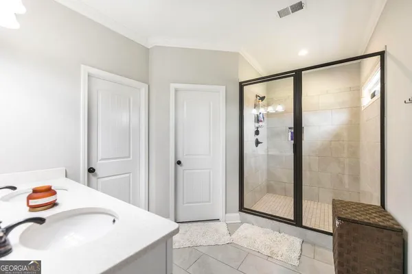 a bathroom with a sink and a shower