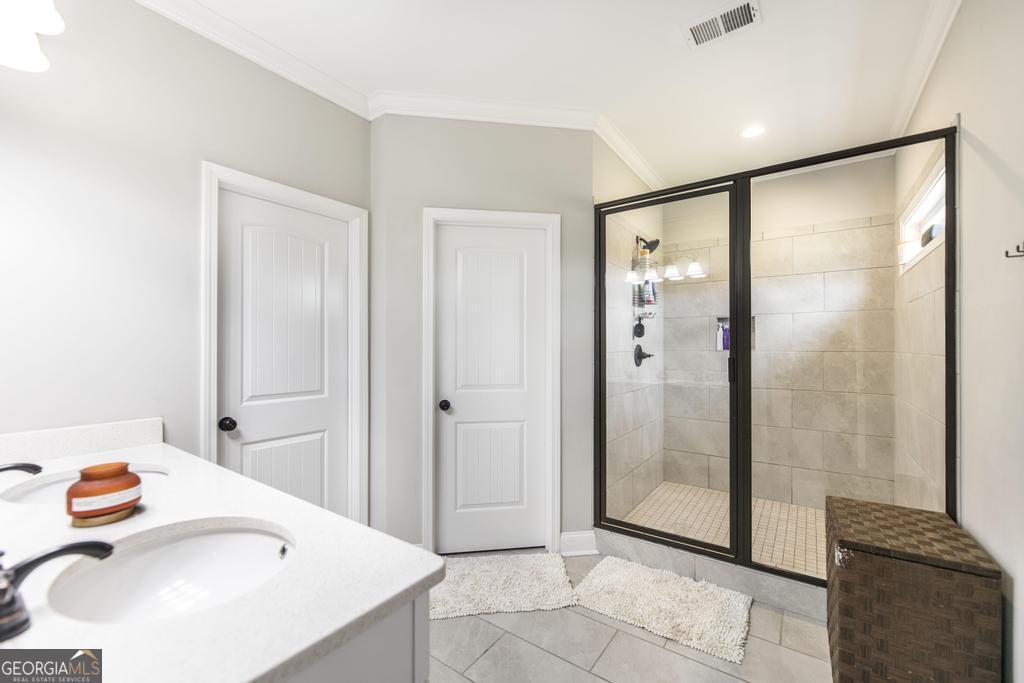 309 Charles Gray Boulevard Perry, GA 31069 - Photo 20 of 30 a bathroom with a sink and a shower