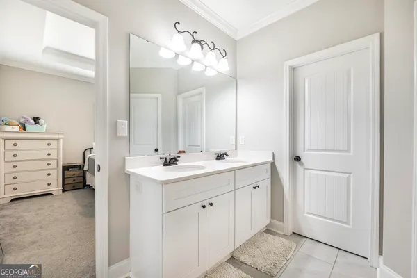 a bathroom with a double vanity sink mirror and