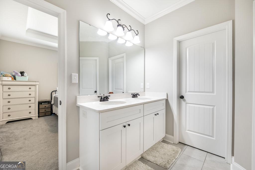 309 Charles Gray Boulevard Perry, GA 31069 - Photo 21 of 30 a bathroom with a double vanity sink mirror and