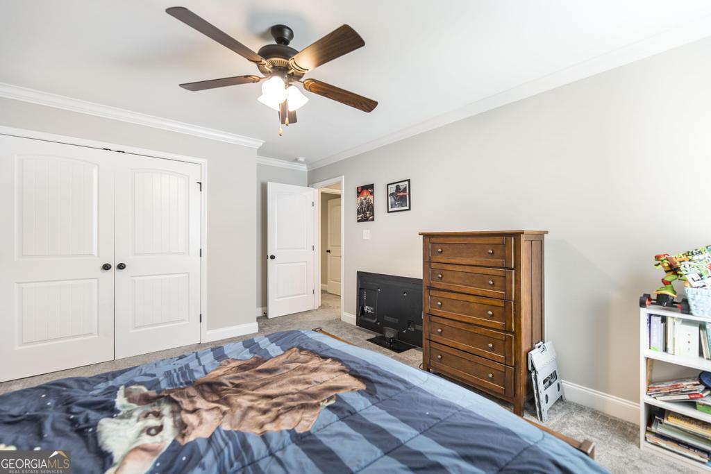 309 Charles Gray Boulevard Perry, GA 31069 - Photo 24 of 30 a bedroom with a bed and a television