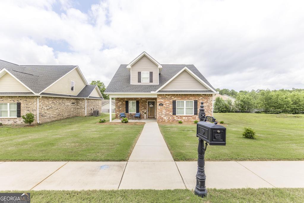 309 Charles Gray Boulevard Perry, GA 31069 - Photo 3 of 30 a front view of house with yard and green space