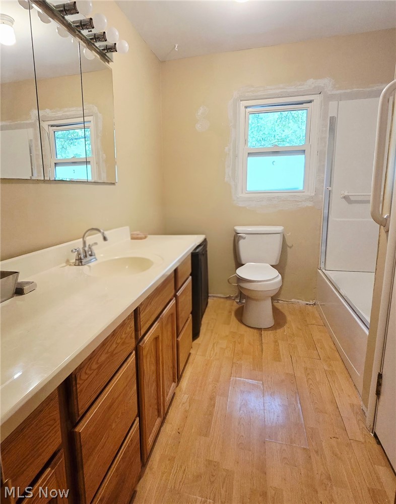 4882 Mogadore Road Kent, OH 44240 - Photo 12 of 16 Vanity with integrated sink, wood-finish cabinetry, and a light-toned countertop