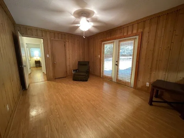 a view of a livingroom with furniture wooden floor and window