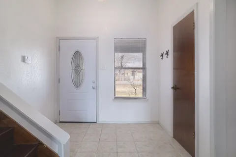 a view of a balcony with wooden floor and fence