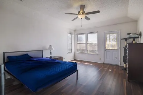 a bathroom with a shower a toilet and a shower