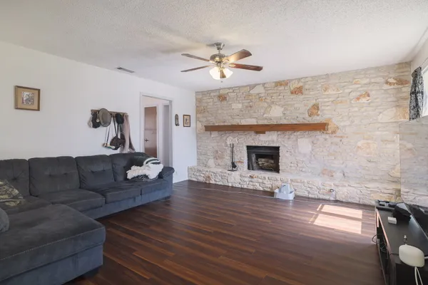 a living room with furniture and a fireplace