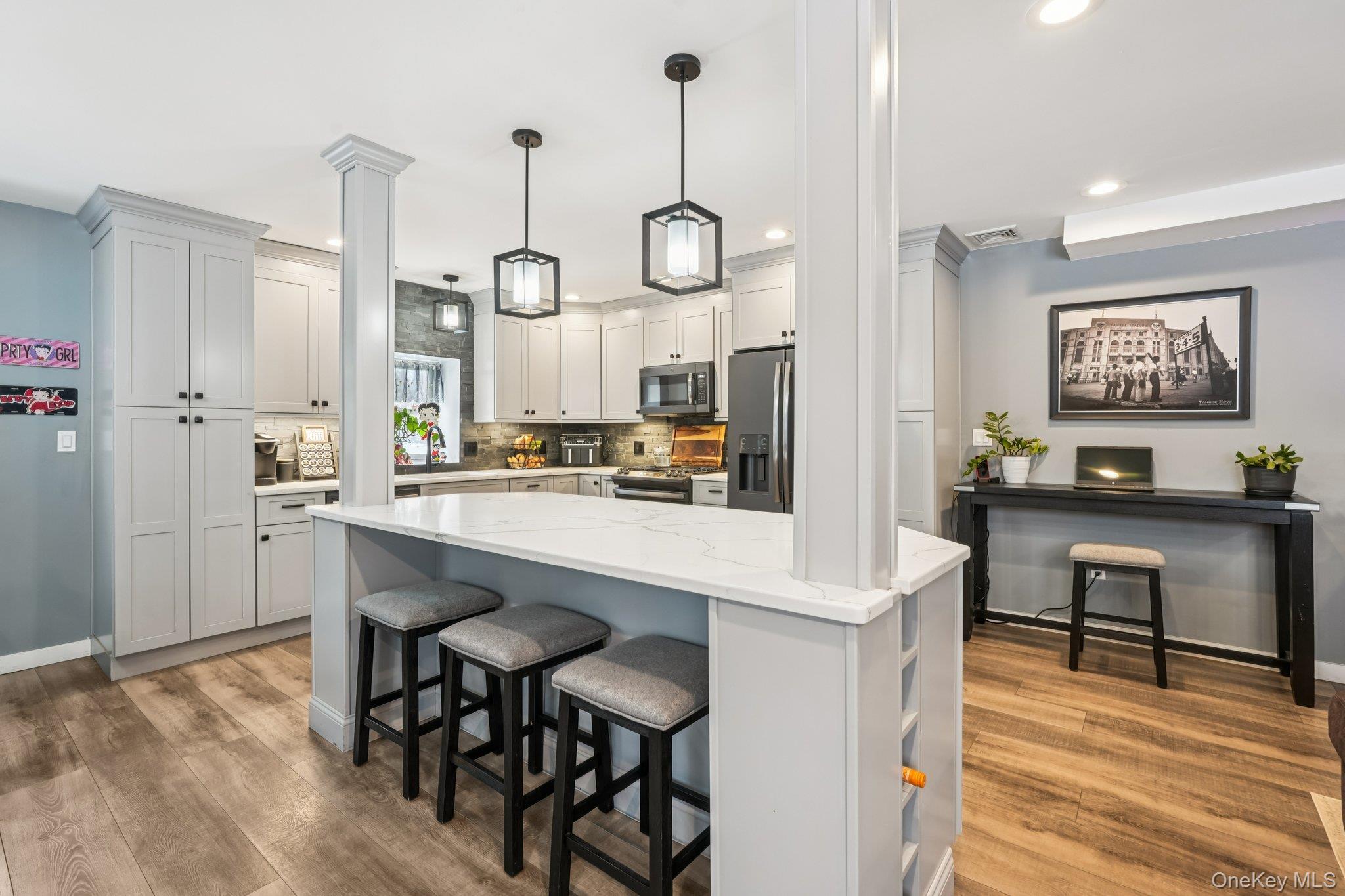 184 Quaker Street Wallkill, NY 12589 - Photo 13 of 35 a kitchen with a table and chairs in it