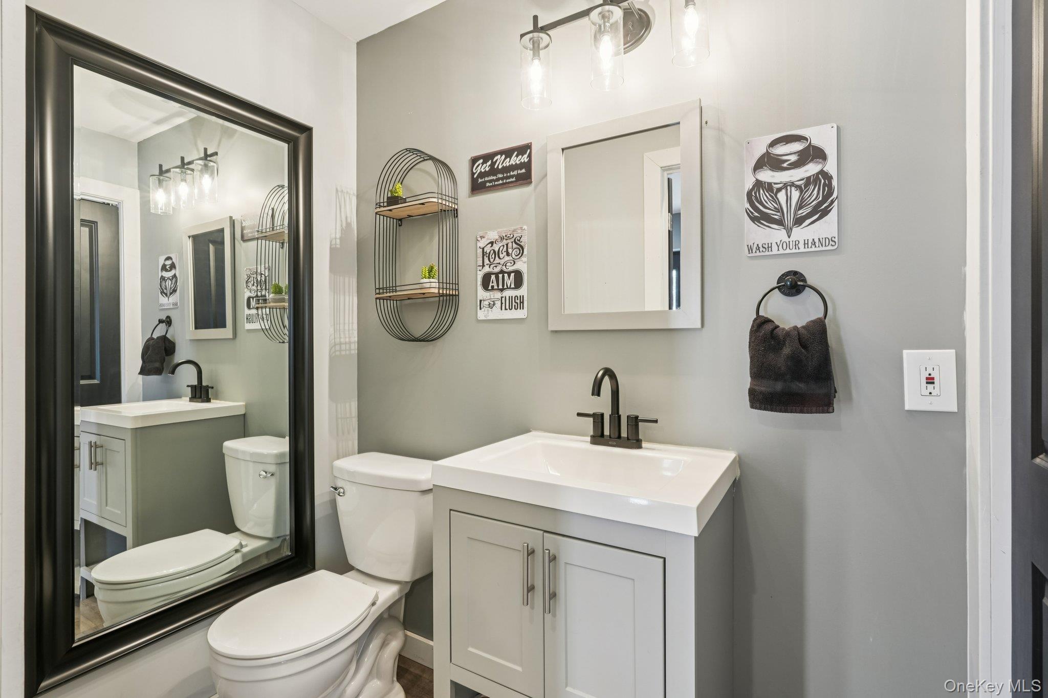 184 Quaker Street Wallkill, NY 12589 - Photo 14 of 35 a bathroom with a toilet sink and mirror
