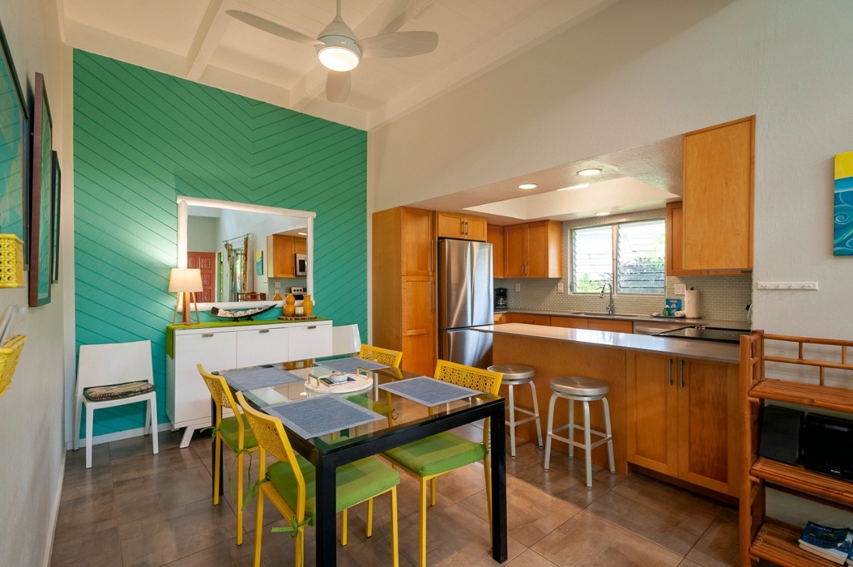 3880 Wyllie Road, Unit 1A Princeville, HI 96722 - Photo 4 of 22 a kitchen with a table and chairs in it