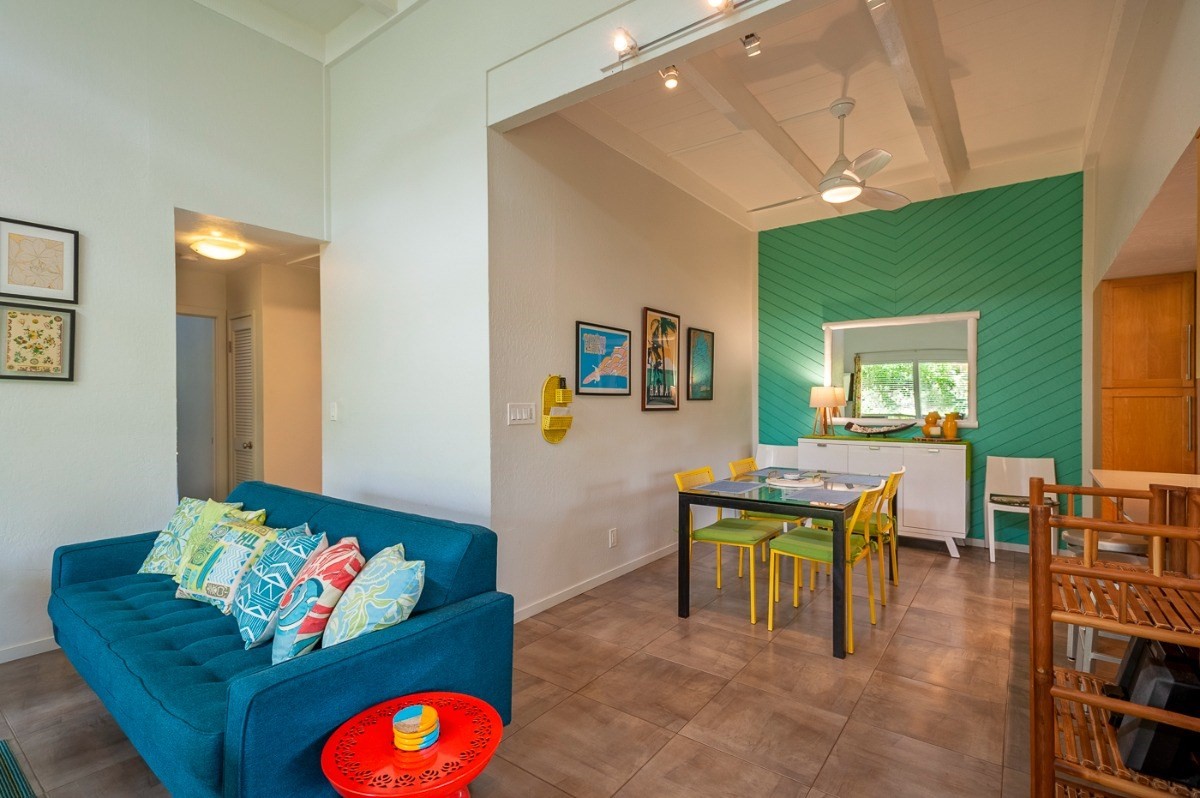 3880 Wyllie Road, Unit 1A Princeville, HI 96722 - Photo 7 of 22 a living room with furniture and a table