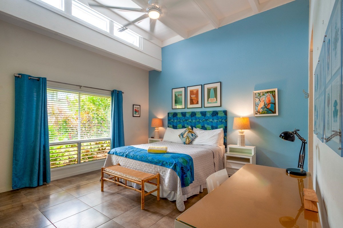 3880 Wyllie Road, Unit 1A Princeville, HI 96722 - Photo 9 of 22 a bedroom with a bed and a window