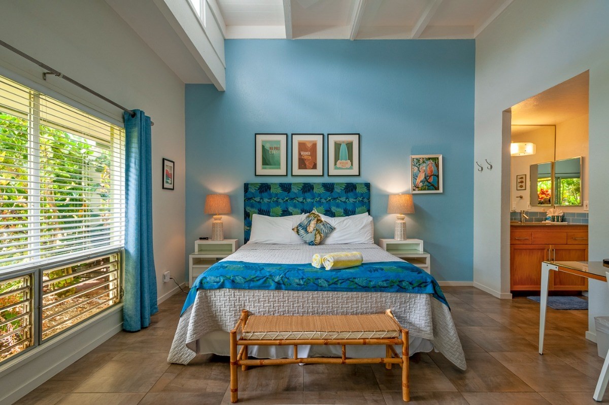 3880 Wyllie Road, Unit 1A Princeville, HI 96722 - Photo 10 of 22 a living room with furniture and a window