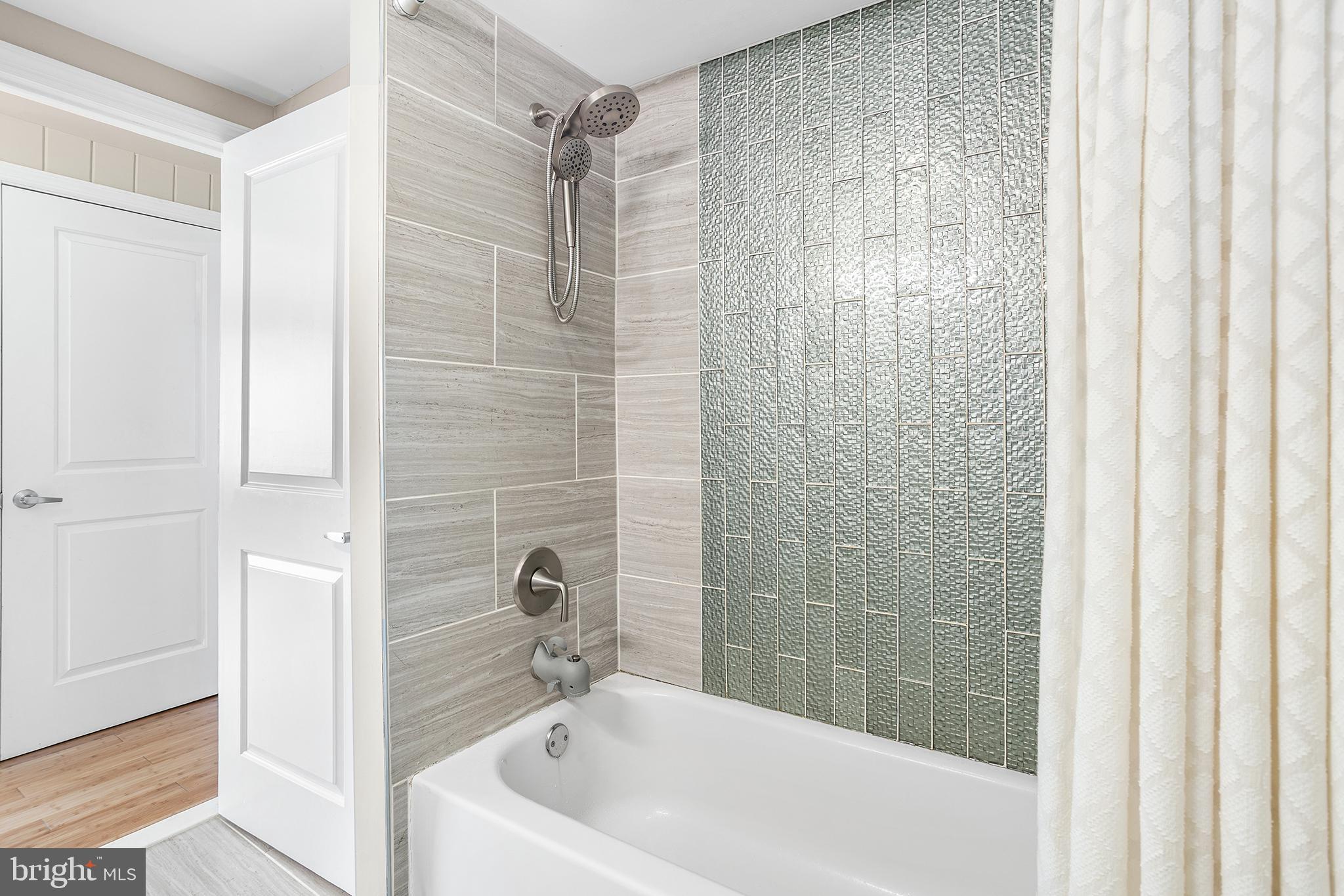 48 Falmouth Road Hamilton, NJ 08620 - Photo 16 of 34 a bathroom with a bathtub and shower