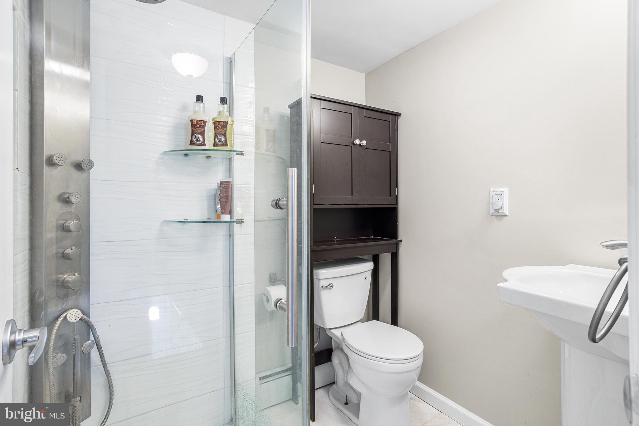 48 Falmouth Road Hamilton, NJ 08620 - Photo 19 of 34 a bathroom with a toilet and a sink